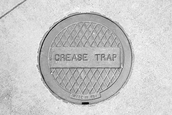 specialized vacuum trucks are used for grease trap pumping to efficiently remove the grease and waste